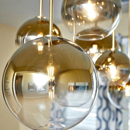 Sleek Sphere Hanging Light with Luxurious Brass Finish